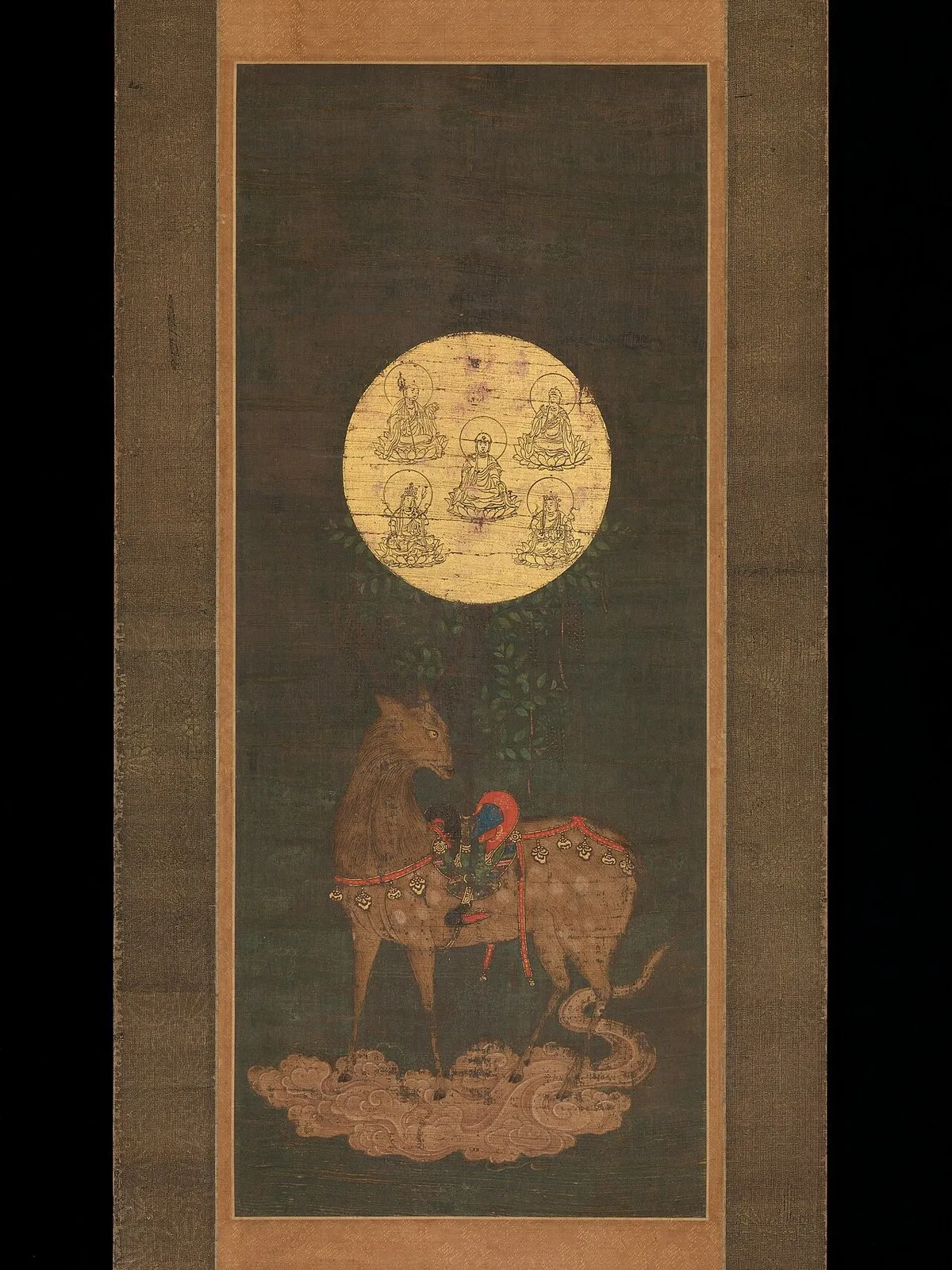 Hanging scroll: a saddled deer stands on a cloud under a large golden disc showing seated Buddhist figures.